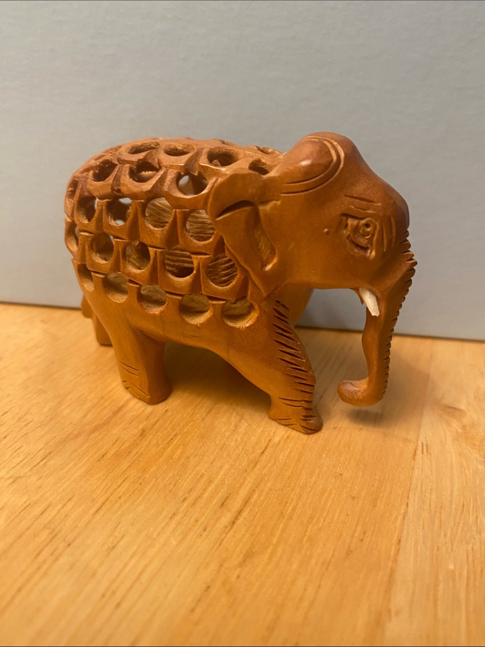 Hand-Carved Wooden Elephant Figurine in Warm Brown with baby elephant in stomach